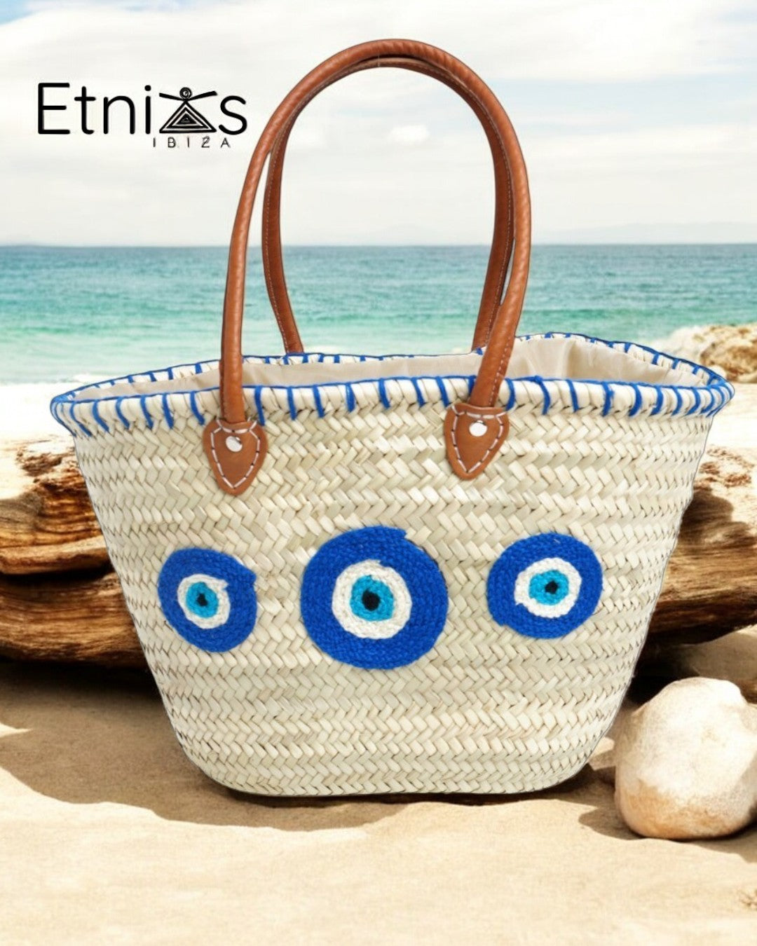 Carrycot with protective eyes · Natural palm and handmade leather