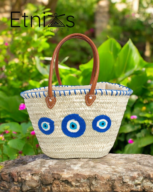 Carrycot with protective eyes · Natural palm and handmade leather