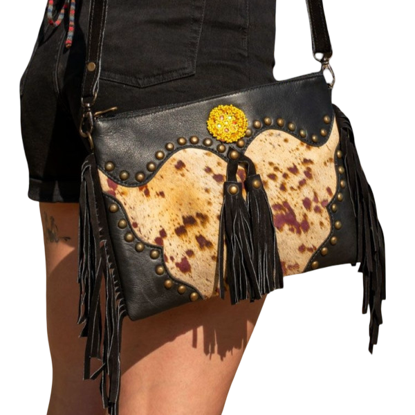 Recycled leather clutch with fringes – Wild character, tribal essence
