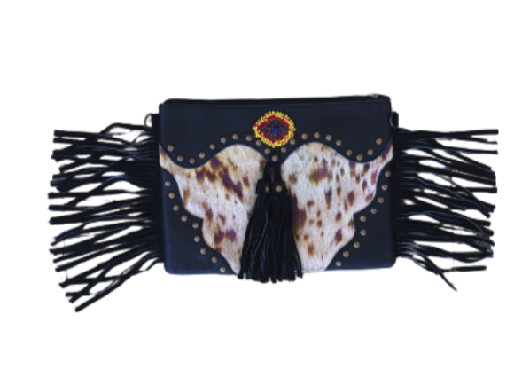 Recycled leather clutch with fringes – Wild character, tribal essence